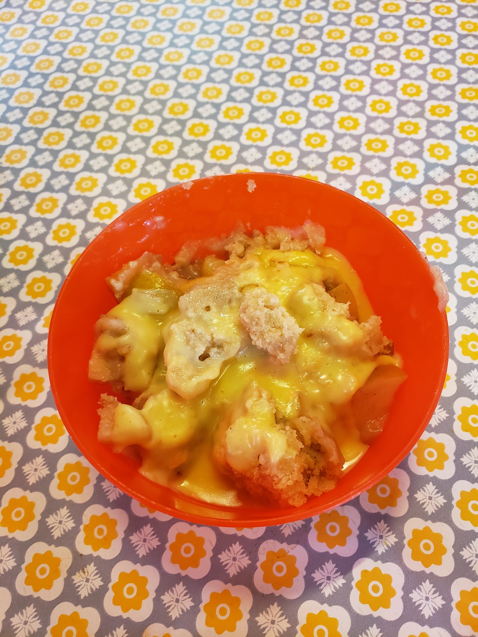 Traditional apple crumble served with hot custard