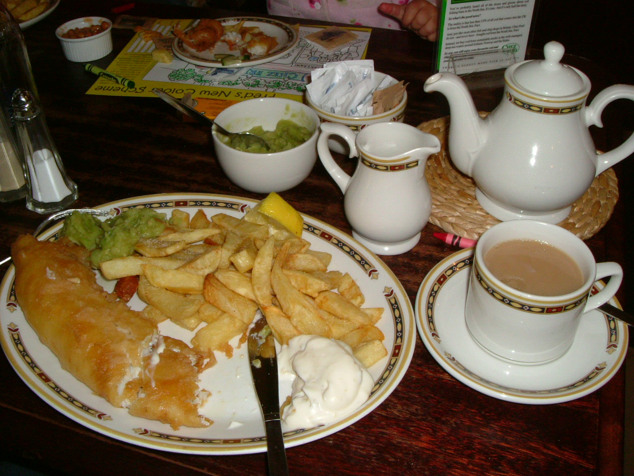Traditional British fish and chips with mushy peas