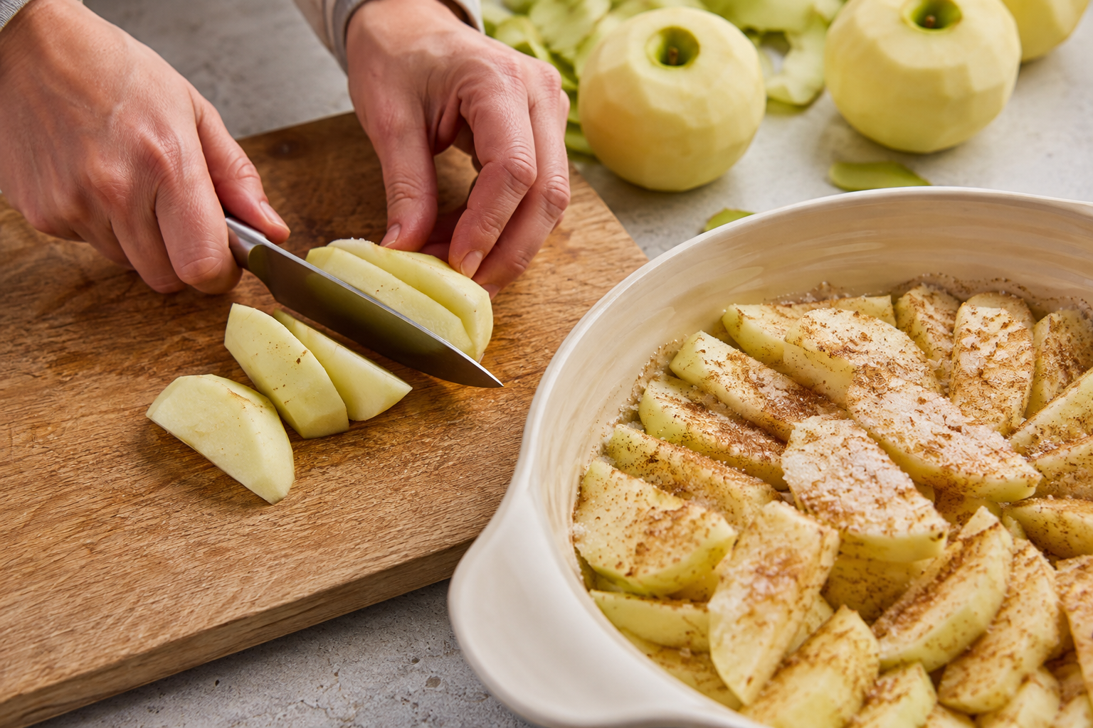 Peeling and slicing Bramley apples for apple crumble