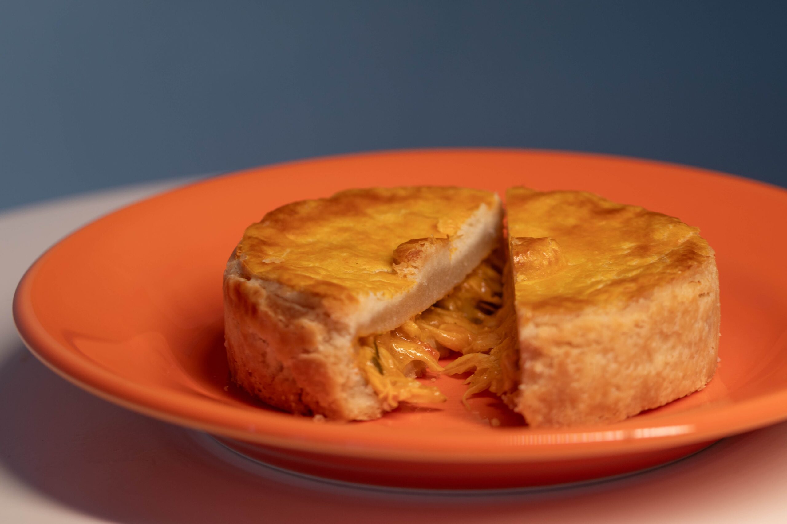 Close-up of a chicken pot pie slice showing creamy chicken and vegetable filling
