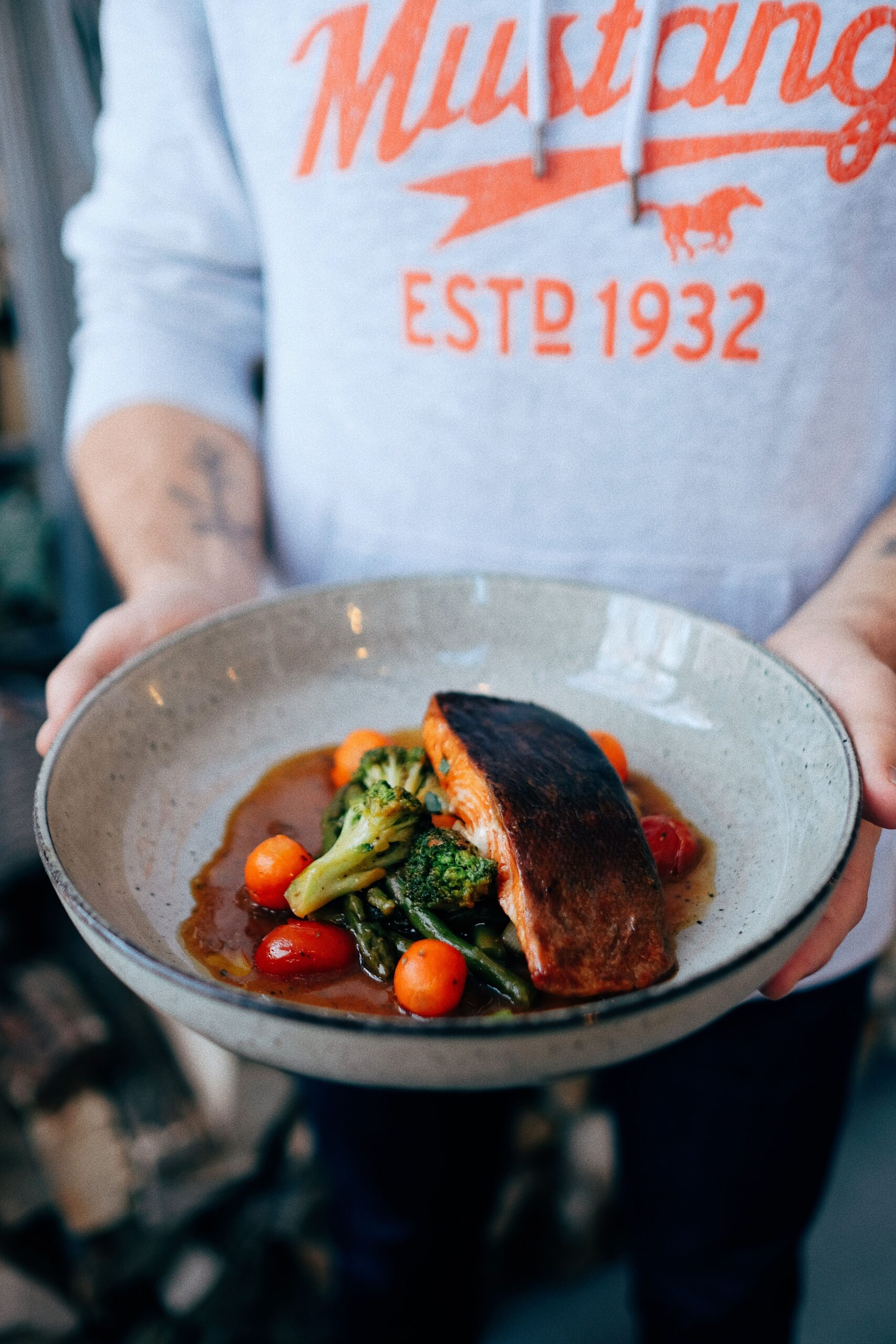 Honey garlic salmon served with vegetables in a glossy sauce