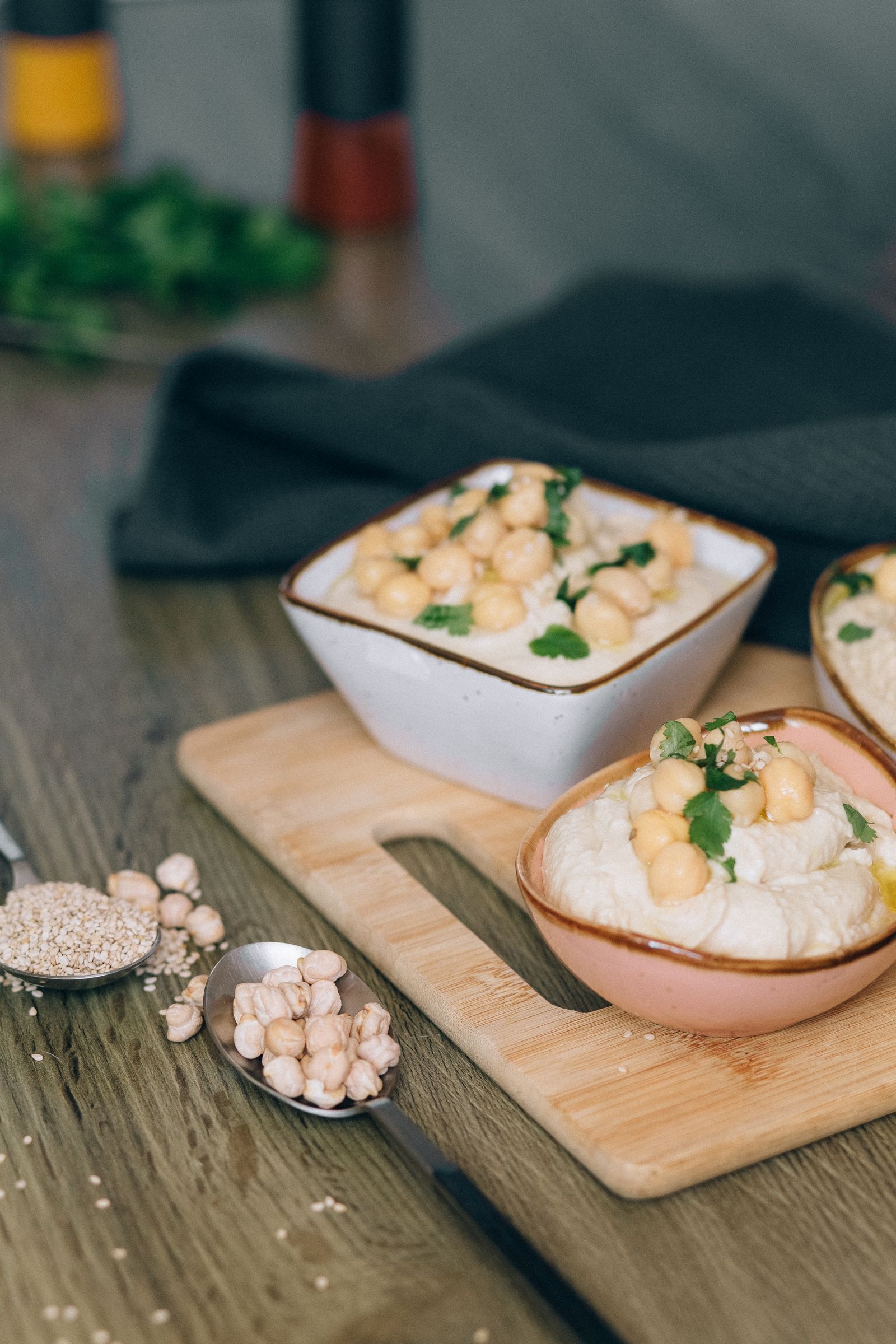 A close-up of homemade hummus topped with chickpeas